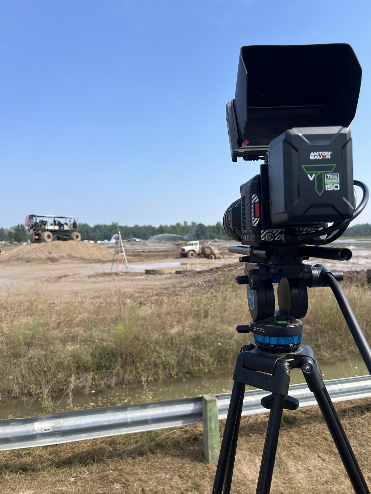Cinema camera on sticks covering an off-road event