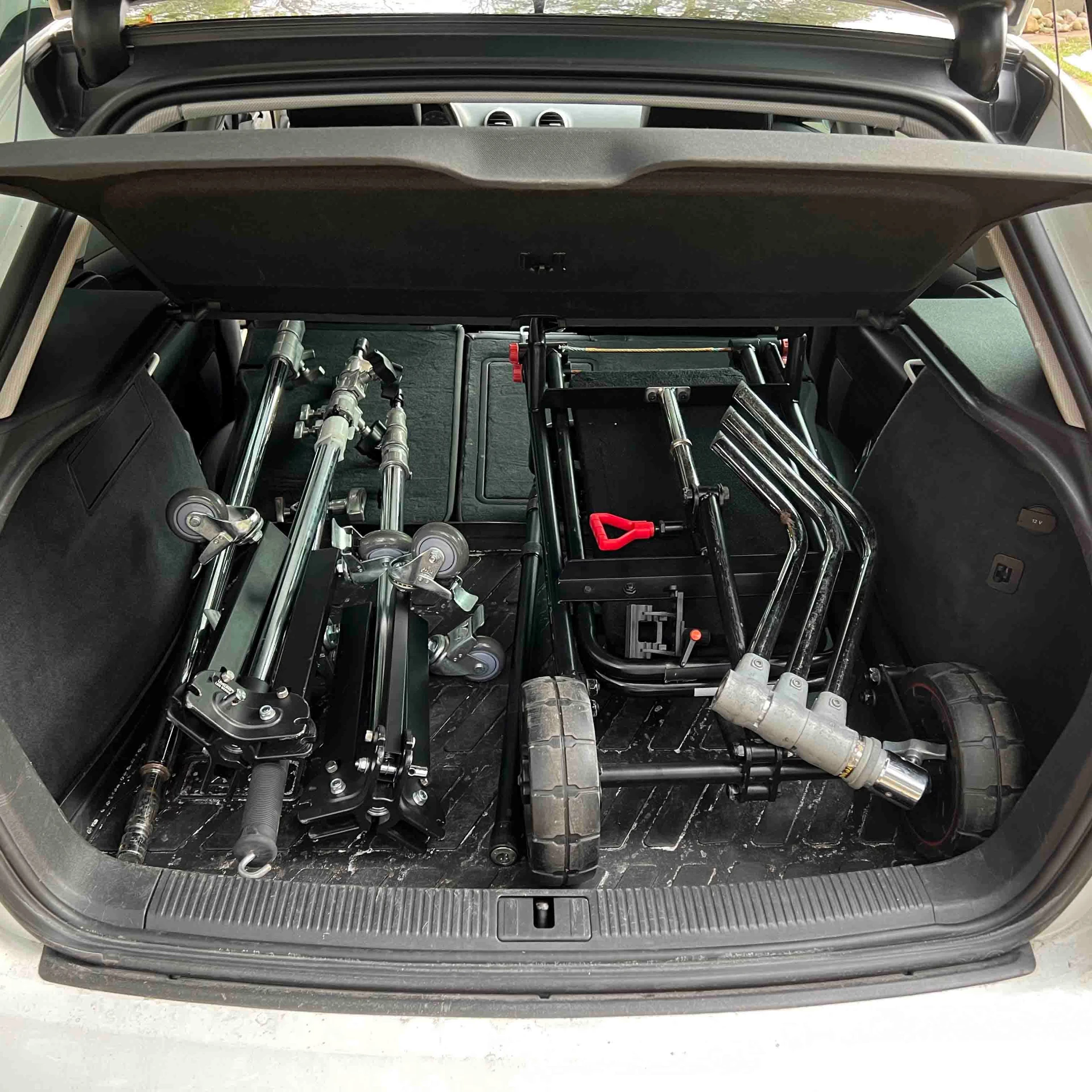 Dolly, track and grip gear packed into a car trunk